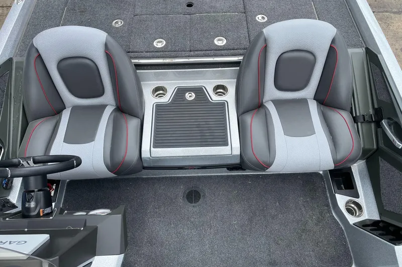 Slide: The Image of 2024 Ranger Z518 Garmin Ranger Cup boat interior with dual seats and console. - 20