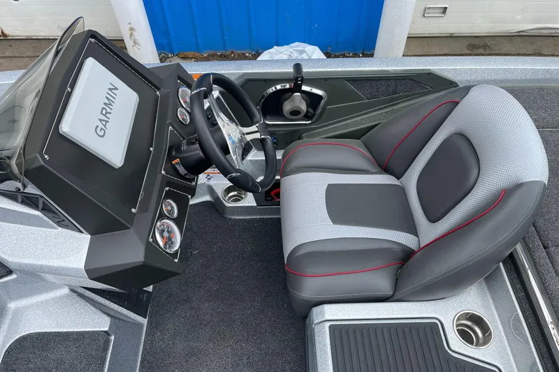 Slide: The Image of 2024 Ranger Z518 Garmin Ranger Cup boat cockpit with Garmin display and comfortable seating. - 21
