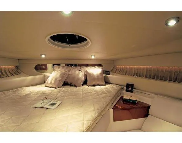 Slide: The Image of Luxurious cabin interior of 2006 Regal Commodore 3760 IO yacht with cozy bedding. - 4