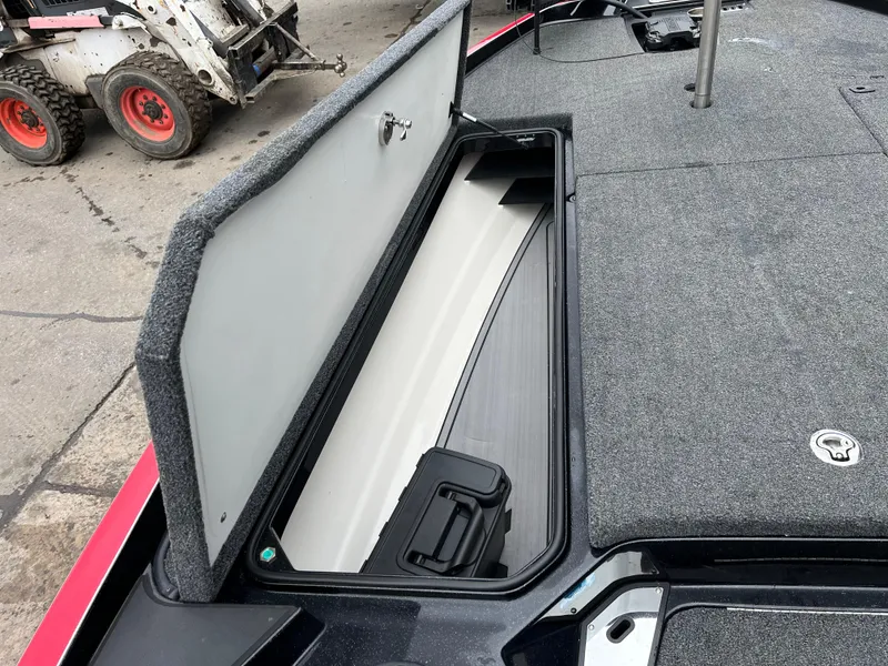 Slide: The Image of 2024 Ranger Z521 RC boat storage compartment open, showcasing interior space and design. - 10