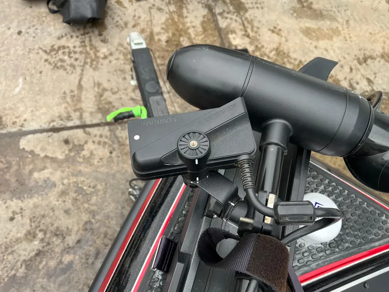 Slide: The Image of 2024 Ranger Z521 RC boat equipment with mounted electronic device and cables. - 14