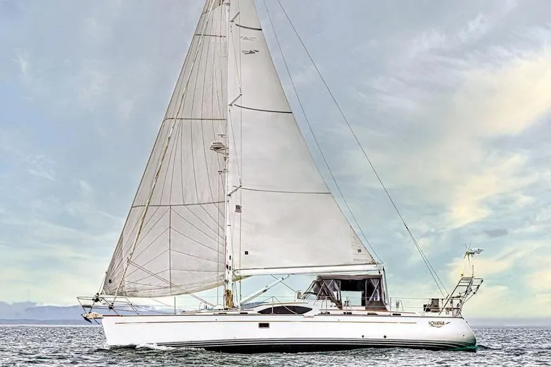 The Image of Sailing yacht Passport 545 Vista 2014 on open water under a cloudy sky. - 0