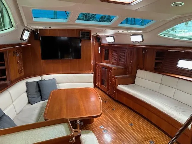 Slide: The Image of Luxurious interior of 2014 Passport 545 Vista yacht with wood finish and seating area. - 1