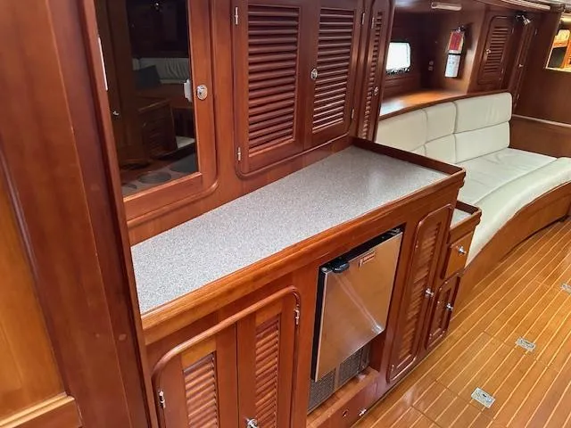 Slide: The Image of Luxurious 2014 Passport 545 Vista yacht interior with wooden cabinetry and seating. - 12