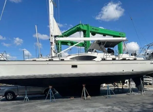 Slide: The Image of Sailboat on stands, 2014 Passport 545 Vista, under clear blue sky. - 20