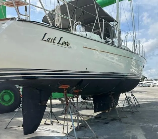 Slide: The Image of Sailboat "Last Love" on stands, Passport 545 Vista, 2014 model, docked outdoors. - 21