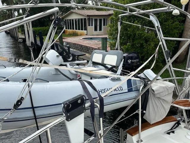 Slide: The Image of Inflatable boat on Passport 545 Vista yacht, docked near waterfront home, 2014 model. - 34