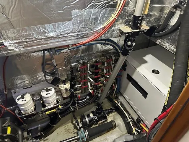 Slide: The Image of Engine room of 2014 Passport 545 Vista yacht, showcasing mechanical systems and components. - 38
