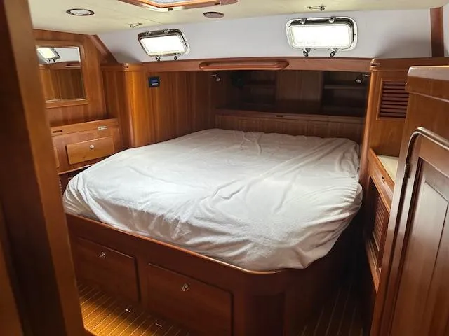 Slide: The Image of Luxurious wooden cabin interior of 2014 Passport 545 Vista yacht with cozy bed. - 6