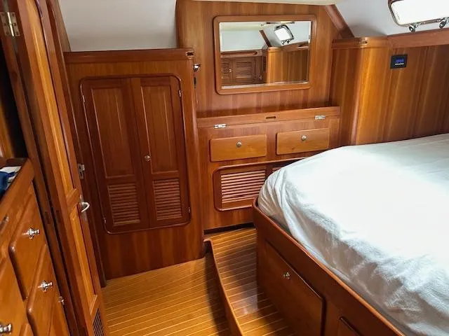 Slide: The Image of Luxurious wooden cabin interior of 2014 Passport 545 Vista yacht with bed and storage. - 9