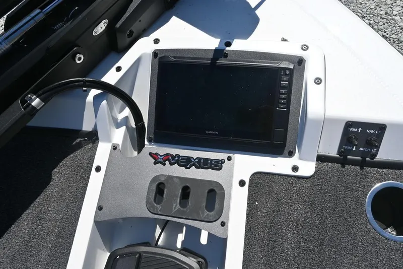 Slide: The Image of 2025 Vexus AVX 1980 boat dashboard with electronic display and controls. - 11