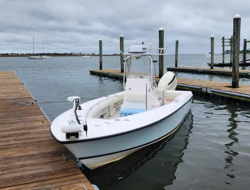 Slide: The Image of 2005 Contender 23 Tournament boat docked on a cloudy day. - 3