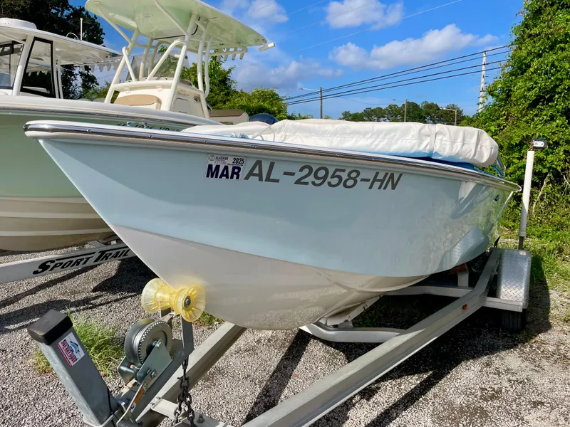 Slide: The Image of 1979 Negus 17 boat on trailer, registration AL-2958-HN, parked outdoors. - 2