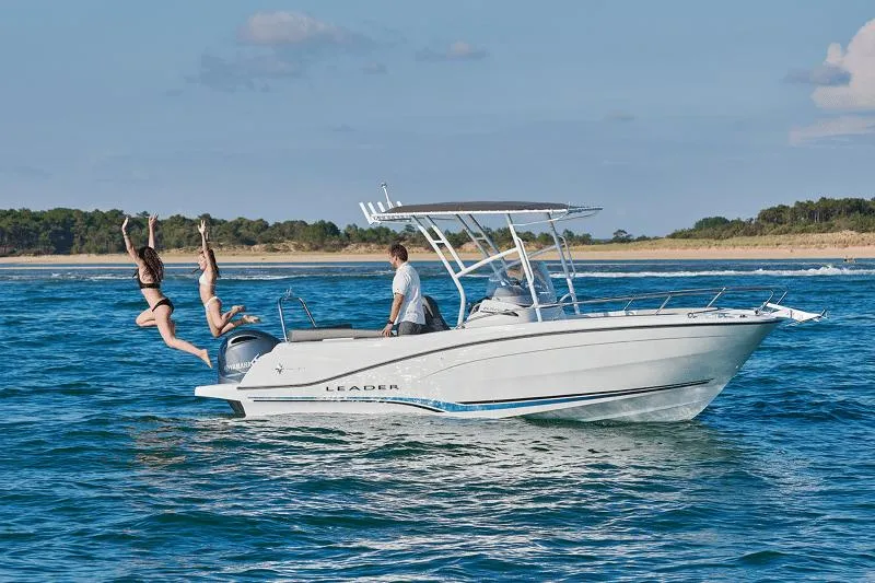 The Image of 2024 Jeanneau Leader 6.5 CC Series 3 boat with people enjoying a sunny day on the water. - 10