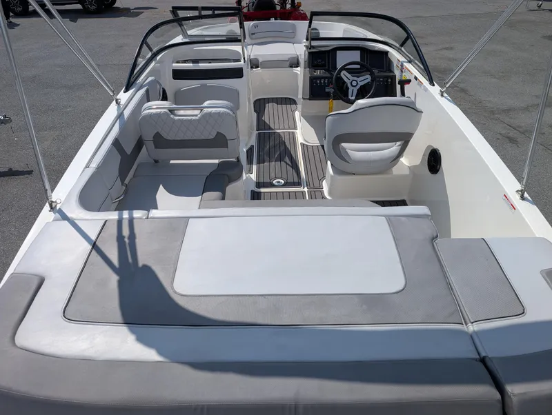 Slide: The Image of 2023 Bayliner VR5 Bowrider I/O interior with seating and steering wheel, showcasing modern design. - 11
