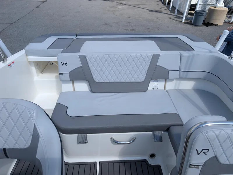 Slide: The Image of 2023 Bayliner VR5 Bowrider I/O interior with gray seating and modern design. - 13