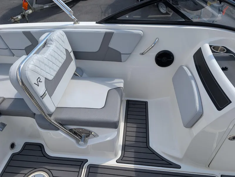 Slide: The Image of 2023 Bayliner VR5 Bowrider I/O interior with gray seating and modern design. - 14