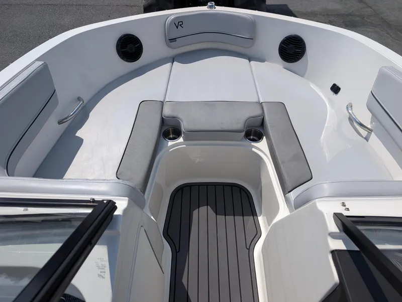 Slide: The Image of 2023 Bayliner VR5 Bowrider I/O interior with gray seating and cup holders. - 18