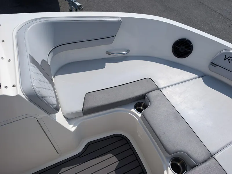 Slide: The Image of 2023 Bayliner VR5 Bowrider I/O boat interior with cushioned seating and cup holders. - 19