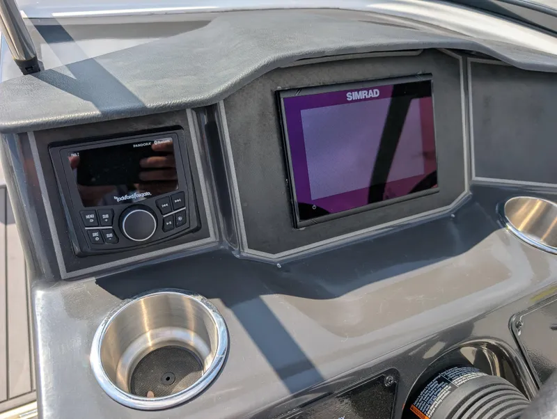 Slide: The Image of 2023 Bayliner VR5 Bowrider I/O dashboard with Simrad display and Rockford Fosgate audio system. - 21