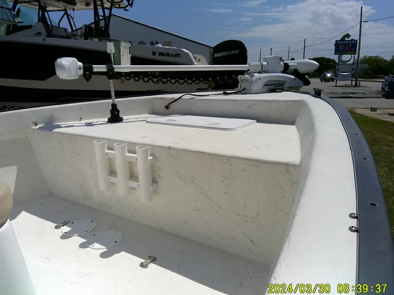Slide: The Image of 2016 Key Largo 160 CC boat deck with rod holders and trolling motor. - 10