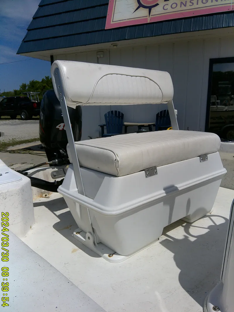 Slide: The Image of 2016 Key Largo 160 CC boat seat with storage, outdoor setting. - 12