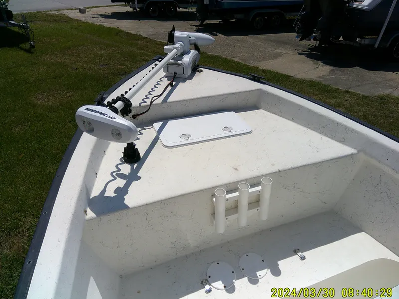Slide: The Image of 2016 Key Largo 160 CC boat with trolling motor and rod holders. - 14