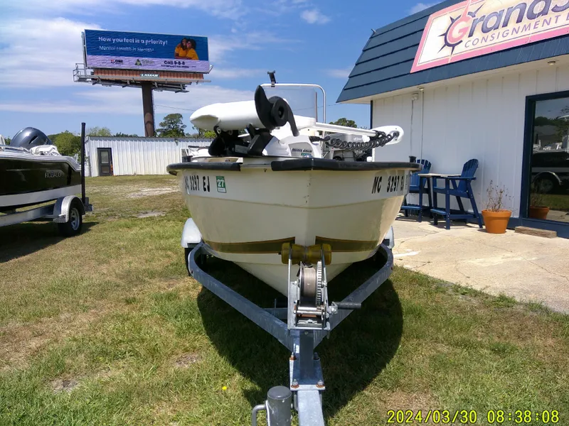 Slide: The Image of 2016 Key Largo 160 CC boat on trailer outside consignment shop. - 2