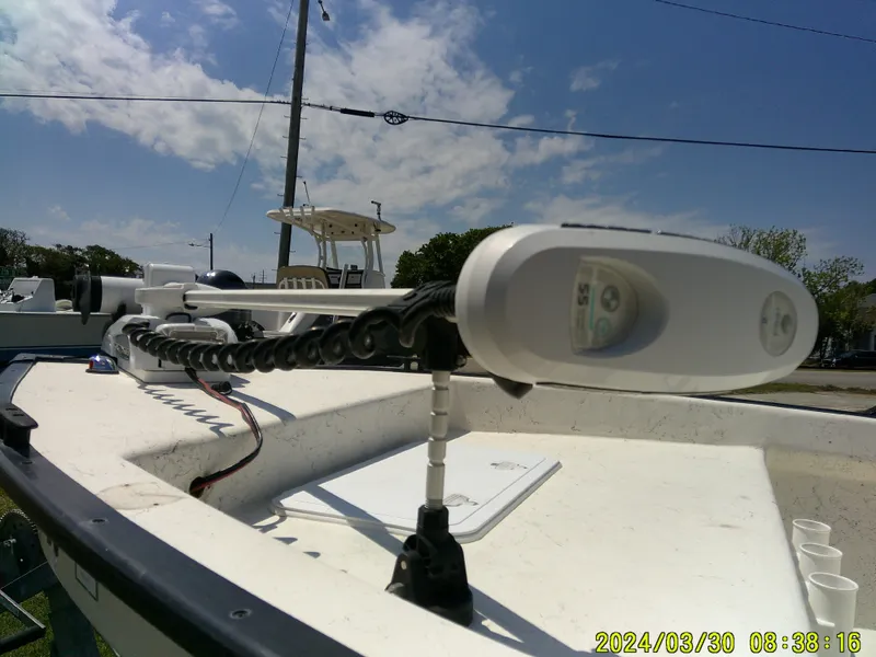 Slide: The Image of 2016 Key Largo 160 CC boat with mounted equipment under a clear sky. - 3