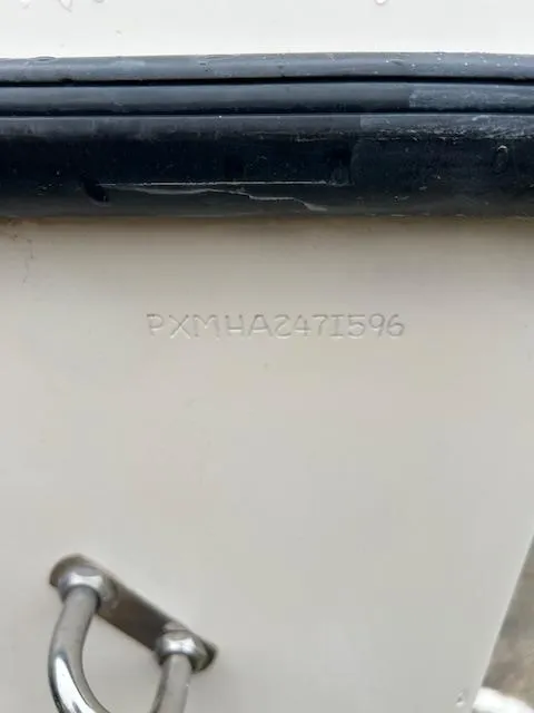 Slide: The Image of 1996 Parker 2300 DV Center Console boat with visible hull identification number. - 9