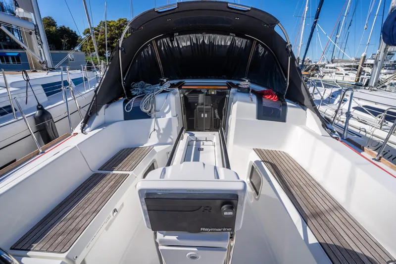 Slide: The Image of Cockpit of 2020 Jeanneau Sun Odyssey 389 sailboat with seating and navigation equipment. - 9