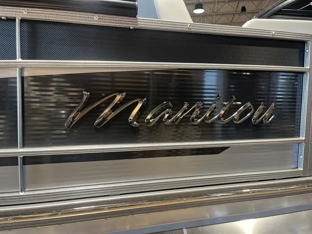Slide: The Image of 2024 Manitou LX 23 RFXW boat with sleek metallic design and logo detail. - 12
