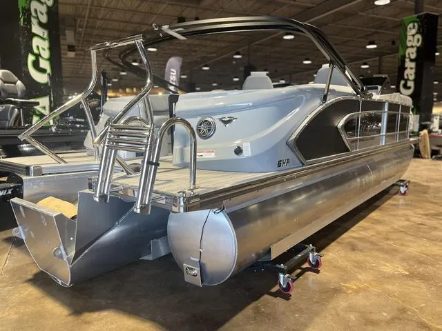 Slide: The Image of 2024 Manitou LX 23 RFXW pontoon boat with sleek design and rear-facing seats. - 3