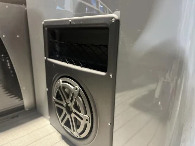 Slide: The Image of 2024 Manitou LX 23 RFXW boat speaker detail with sleek design. - 9