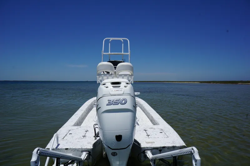 Slide: The Image of 2019 Haynie 23 Super Cat boat with 350 engine on calm water. - 4