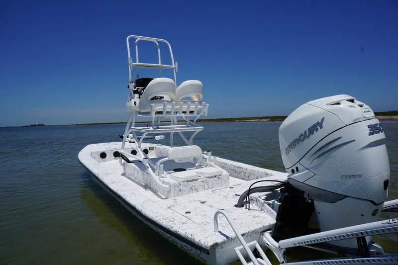 Slide: The Image of 2019 Haynie 23 Super Cat boat with Mercury engine on calm water. - 5