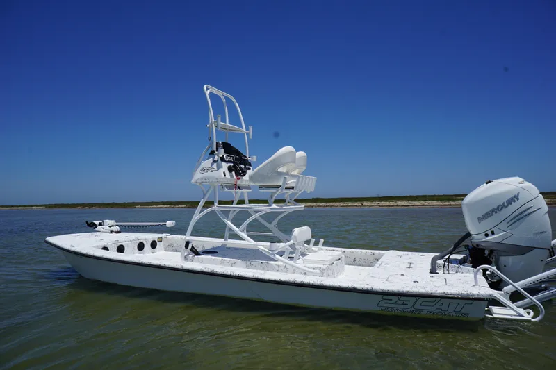 Slide: The Image of 2019 Haynie 23 Super Cat boat on calm water with clear blue sky. - 6