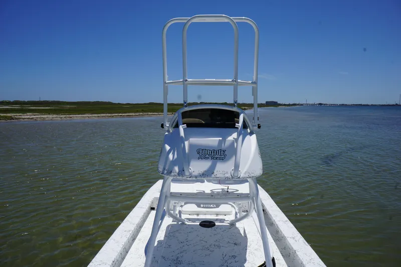 Slide: The Image of 2019 Haynie 23 Super Cat boat on calm water with clear blue sky. - 9