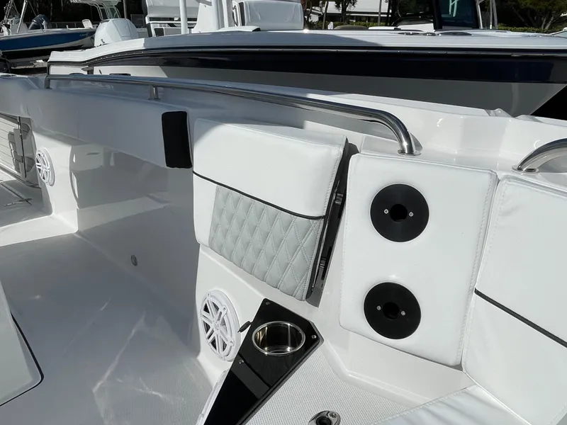 Slide: The Image of 2025 Blackfin 252CC boat interior with white seating and stainless steel railings. - 12