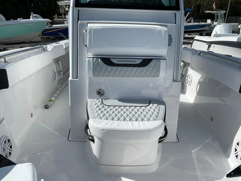Slide: The Image of 2025 Blackfin 252CC boat interior with white seating and sleek design. - 13