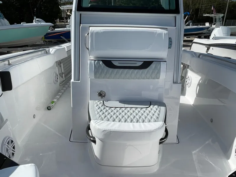 Slide: The Image of 2025 Blackfin 252CC boat interior with white seating and modern design. - 15