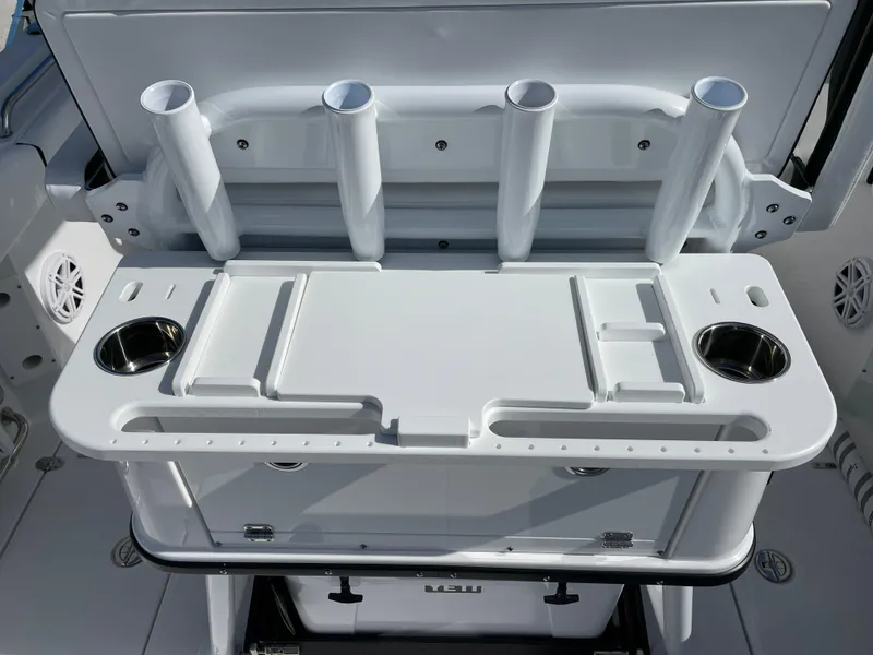 Slide: The Image of 2025 Blackfin 252CC boat with rod holders and cup holders on deck. - 22