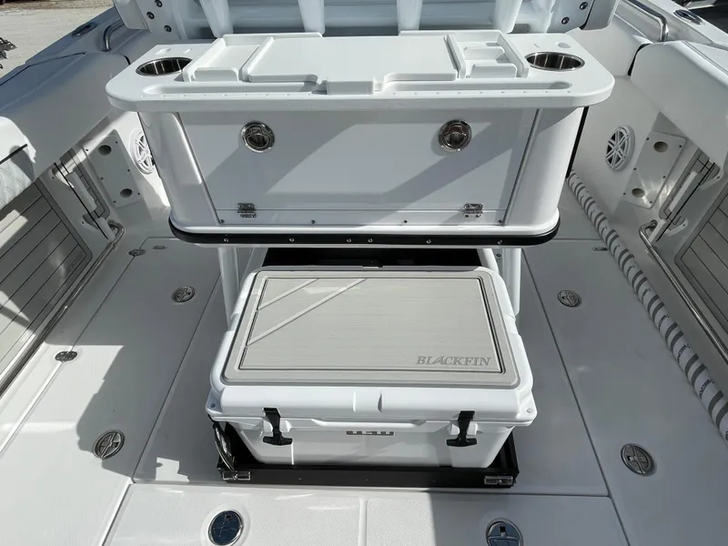 Slide: The Image of 2025 Blackfin 252CC boat deck with storage compartments and seating area. - 23