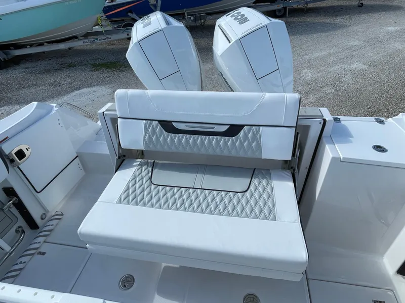 Slide: The Image of 2025 Blackfin 252CC boat with dual engines and luxurious seating. - 26