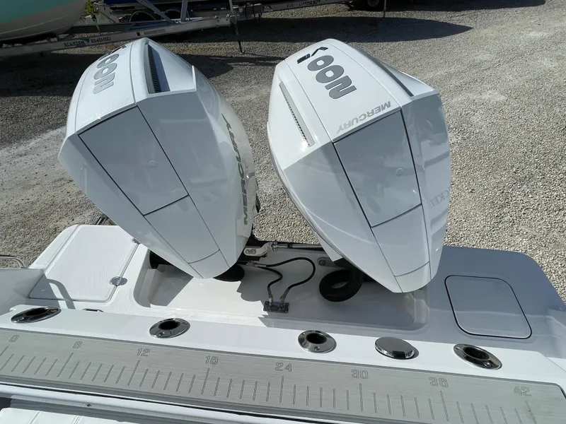 Slide: The Image of Twin Mercury outboard engines on 2025 Blackfin 252CC boat, viewed from above. - 33