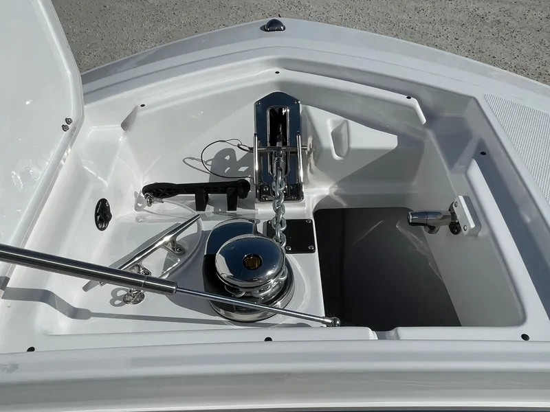 Slide: The Image of 2025 Blackfin 252CC boat anchor compartment with winch and storage. - 6