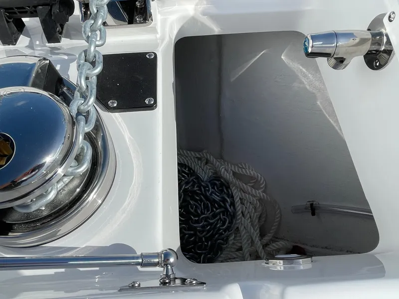 Slide: The Image of 2025 Blackfin 252CC boat anchor system with chain and rope storage. - 7