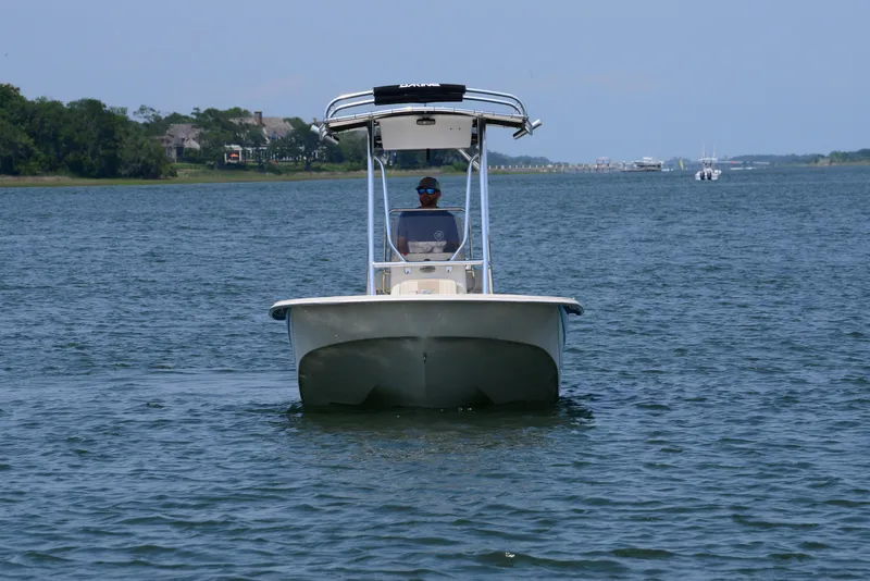 Slide: The Image of 2018 Carolina Skiff 218 DLV boat on calm water, front view. - 2