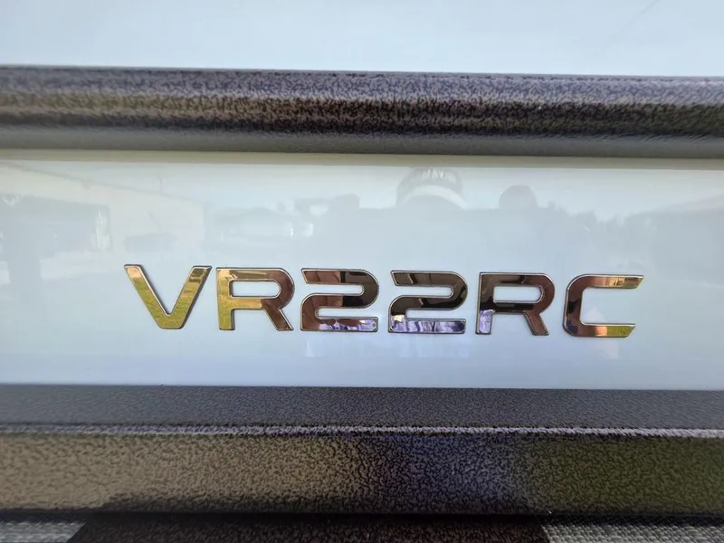 Slide: The Image of 2025 Veranda VR22RC Tri-Toon logo on boat exterior. - 10