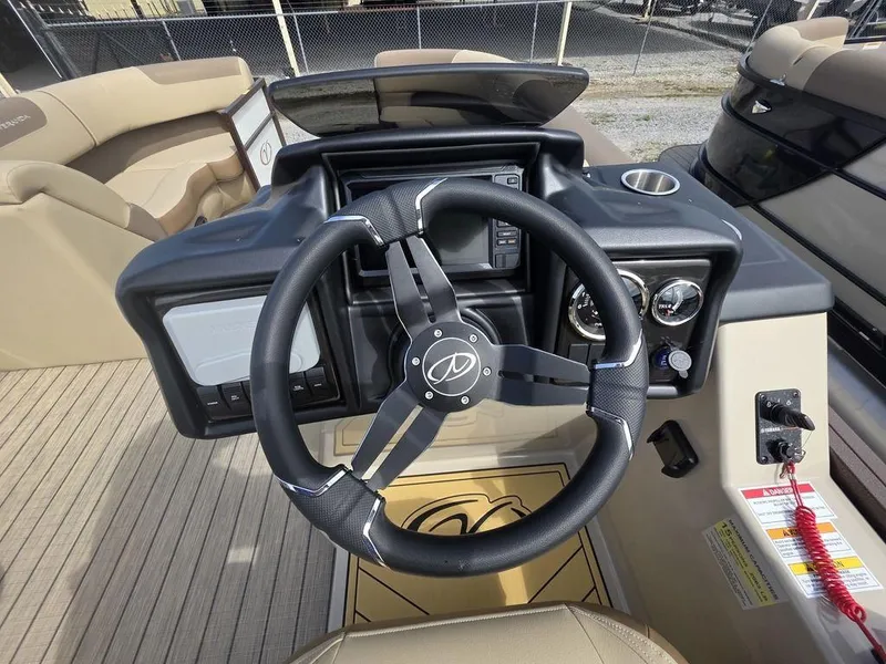 Slide: The Image of 2025 Veranda VR22RC Tri-Toon steering console with modern controls and gauges. - 13